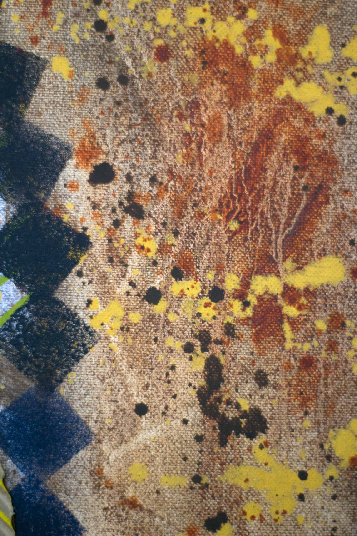 Detail highlighting the richly textured background with layered earth-toned washes, yellow and dark paint splatters, and expressive surface variations surrounding geometric forms.