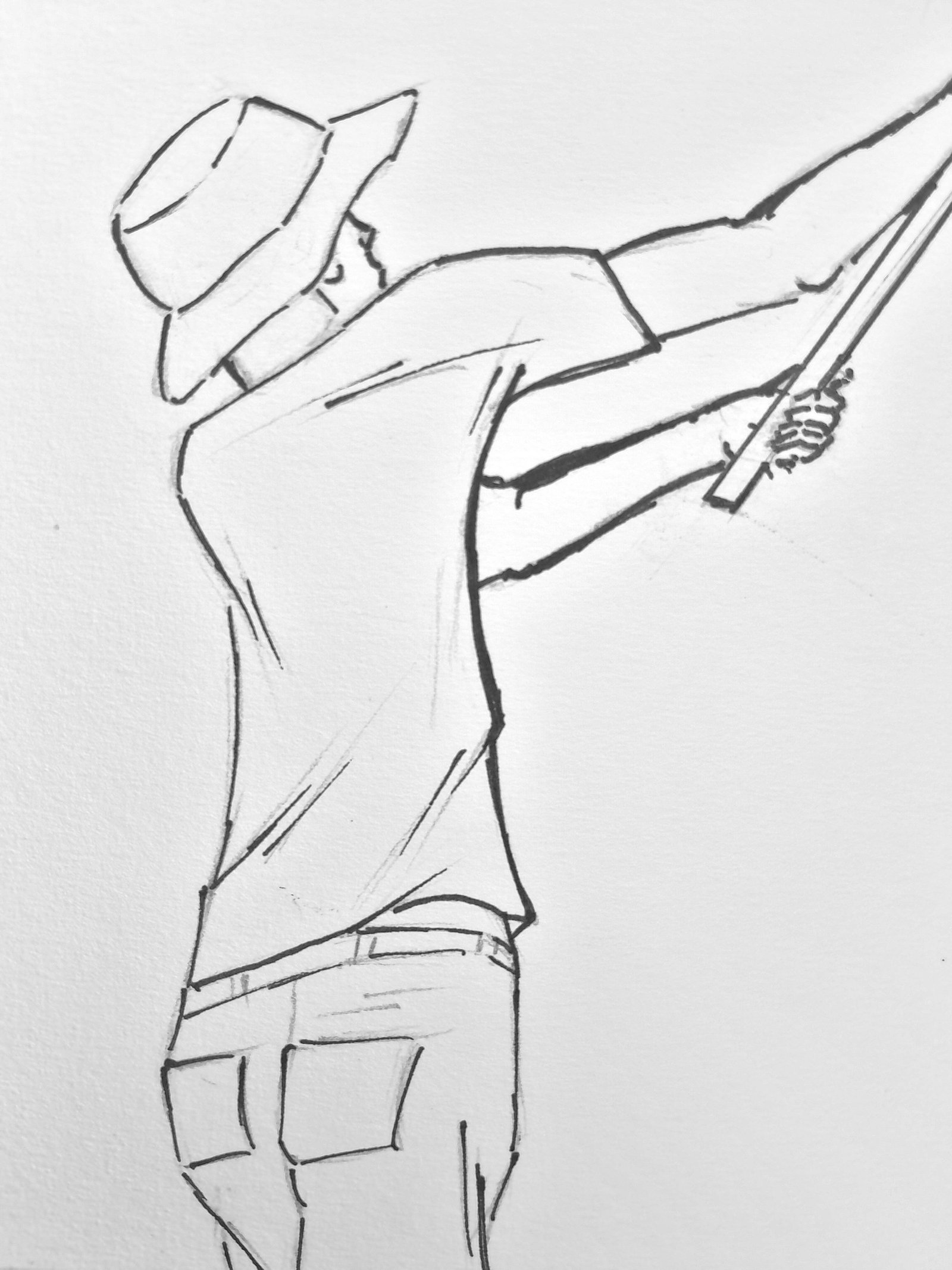 Close-up of the fisherman from behind, wearing a brimmed hat and leaning backward with both arms extended as he grips the fishing rod.