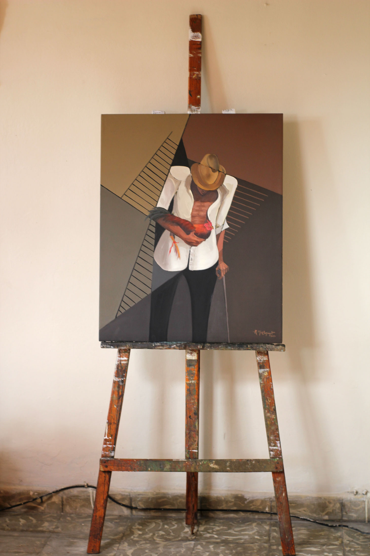 The completed oil painting "Gallero" displayed on a wooden easel inside the artist's studio before exhibition.