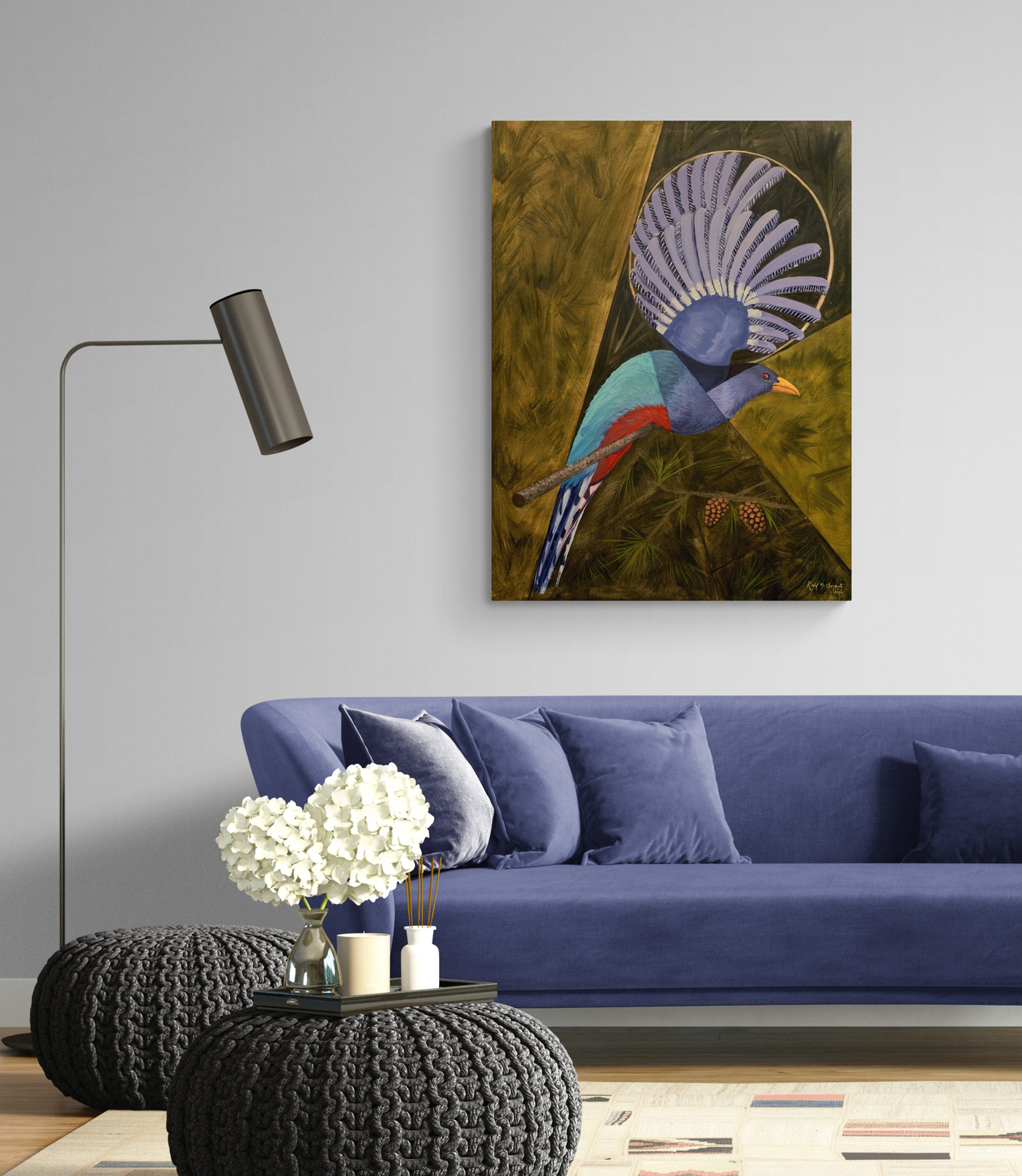 Hispaniolan Trogon installed in a contemporary living room above a blue sofa, demonstrating how the vibrant oil painting complements a modern interior while serving as a striking focal point.
